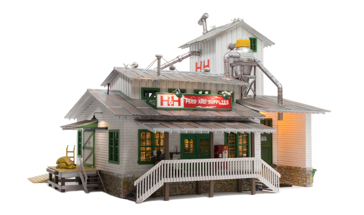 Woodland Scenics BR5859 O scale H&H Feed Mill - front view with lighted H&H Feed and Supplies sign