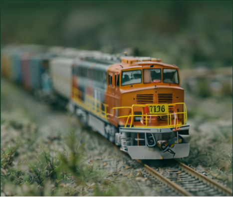 N scale model train running through scenic landscape